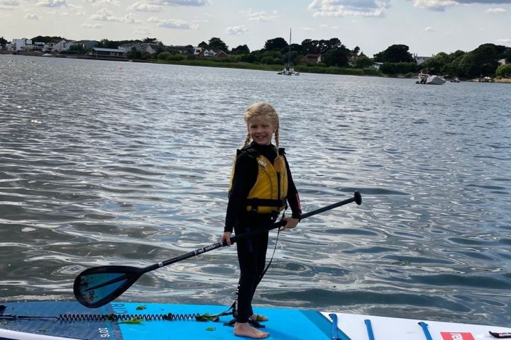 a man rowing a boat in a body of water